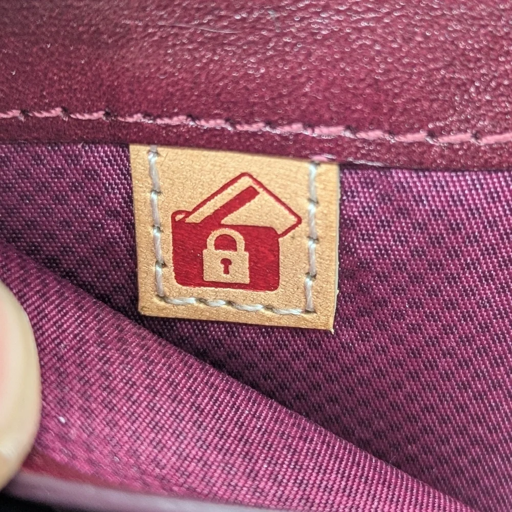 Tumi Plum Purple Leather Wallet